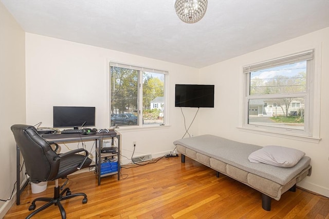 home office featuring baseboards and light wood-style flooring