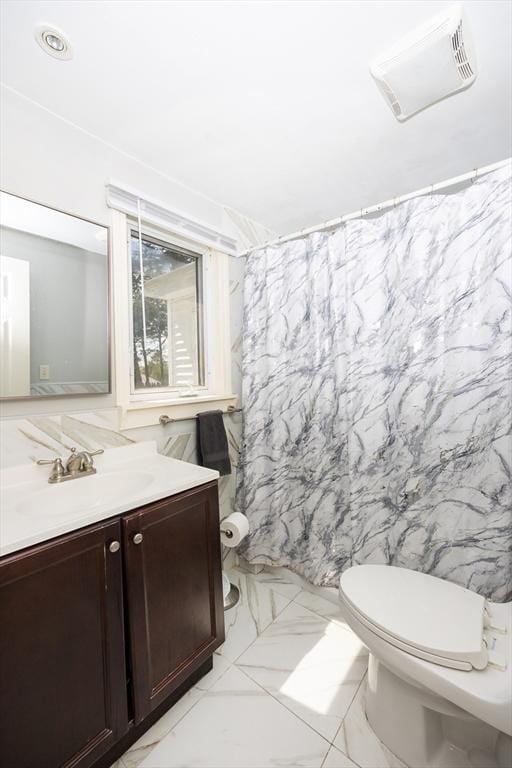 bathroom with toilet, a shower with curtain, marble finish floor, and vanity