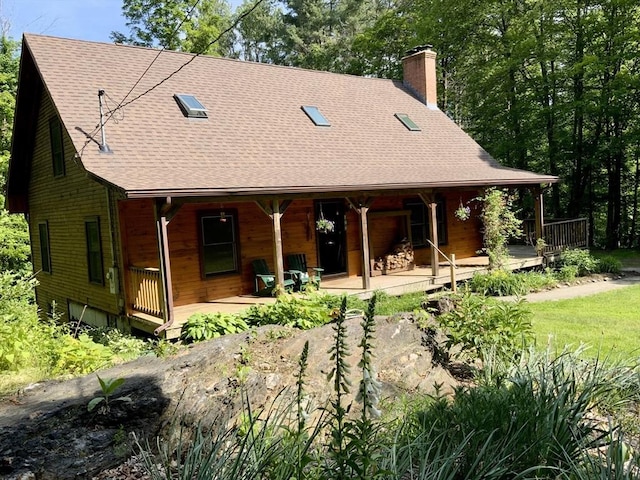 186 Hoosac Rd, Conway, MA 01341 - back of property featuring a chimney, a shingled roof, and covered porch