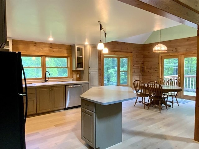 186 Hoosac Rd, Conway, MA 01341 - kitchen with freestanding refrigerator, stainless steel dishwasher, a sink, light wood-style floors, and wood walls