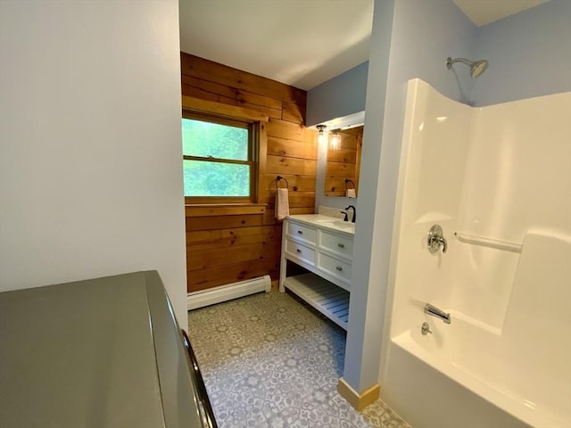 186 Hoosac Rd, Conway, MA 01341 - full bathroom with wood walls, baseboard heating, bathtub / shower combination, vanity, and baseboards