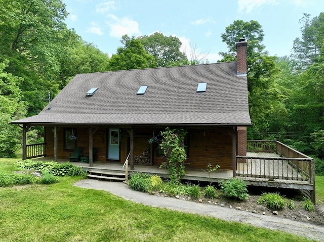 186 Hoosac Rd, Conway, MA 01341 - view of front of property with a chimney, roof with shingles, and a front lawn