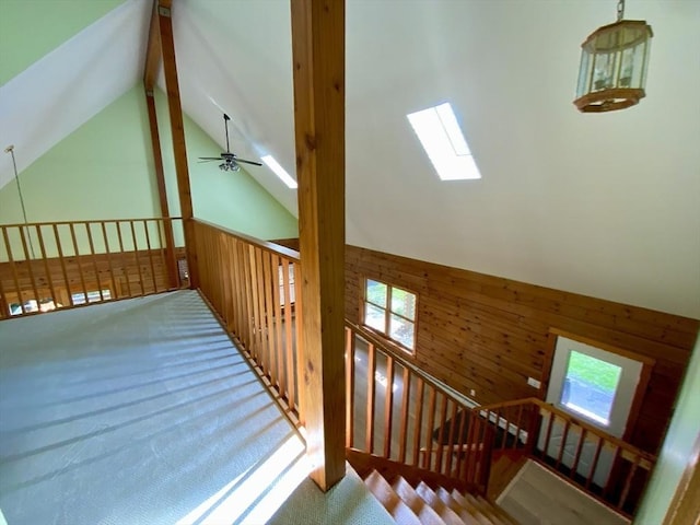 186 Hoosac Rd, Conway, MA 01341 - stairway with carpet, wood walls, a ceiling fan, and high vaulted ceiling