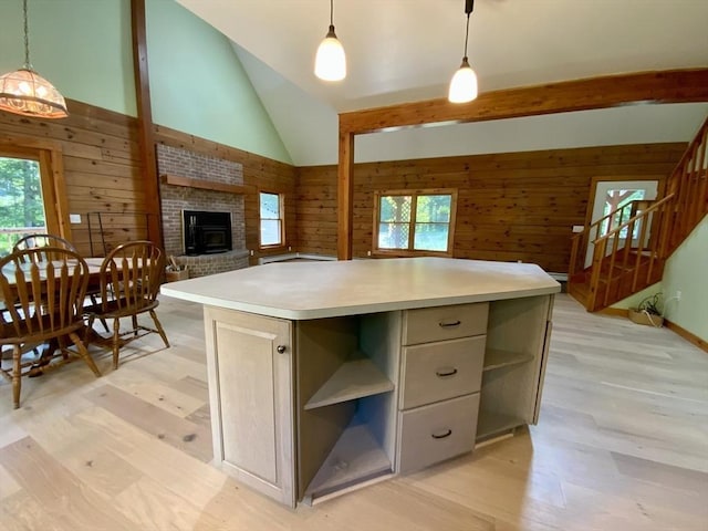 186 Hoosac Rd, Conway, MA 01341 - kitchen with open shelves, healthy amount of natural light, wooden walls, light wood-style flooring, and a fireplace