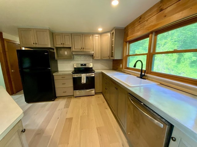 186 Hoosac Rd, Conway, MA 01341 - kitchen featuring stainless steel appliances, a sink, light wood-style flooring, light countertops, and backsplash