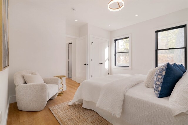 bedroom with light hardwood / wood-style floors