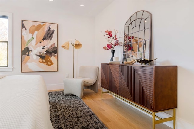 sitting room with hardwood / wood-style floors and a wealth of natural light