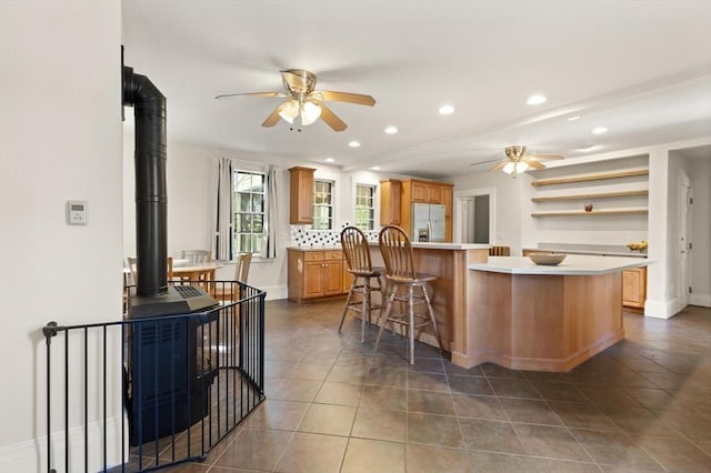 21 College Hill Rd, Somerville, MA 02144 - kitchen featuring refrigerator with ice dispenser, a ceiling fan, open shelves, a kitchen island, and recessed lighting