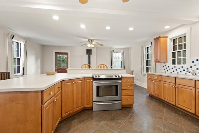 21 College Hill Rd, Somerville, MA 02144 - kitchen with electric stove, ceiling fan, light countertops, recessed lighting, and healthy amount of natural light