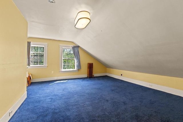 21 College Hill Rd, Somerville, MA 02144 - additional living space with lofted ceiling, carpet flooring, and baseboards