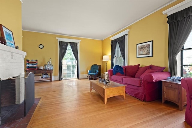 21 College Hill Rd, Somerville, MA 02144 - living room featuring a brick fireplace, wood finished floors, and crown molding