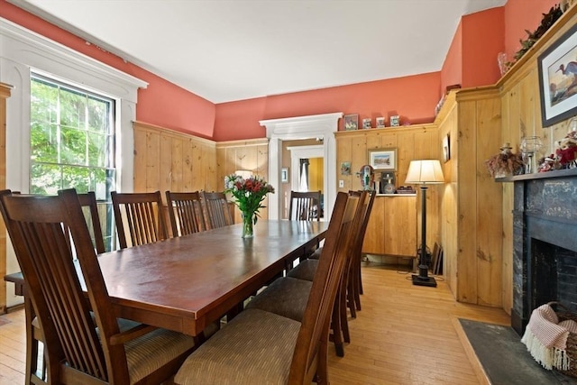 21 College Hill Rd, Somerville, MA 02144 - dining space with light wood finished floors and a fireplace with flush hearth