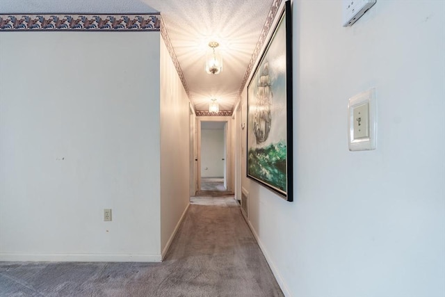 hallway featuring carpet flooring