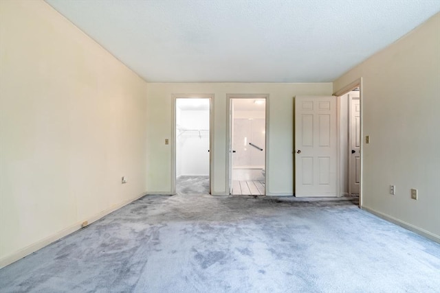 unfurnished room featuring carpet flooring