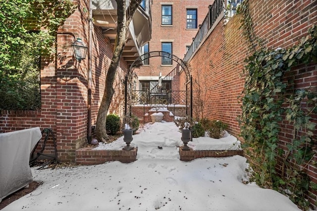 yard layered in snow with fence