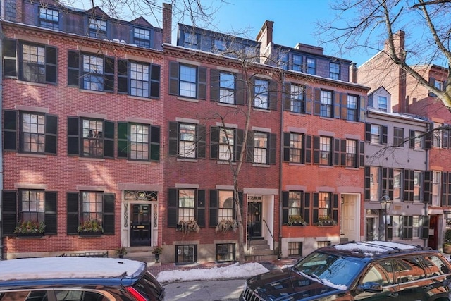 view of apartment building / complex with entry steps