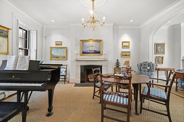 sitting room with a premium fireplace, ornamental molding, a chandelier, recessed lighting, and carpet floors