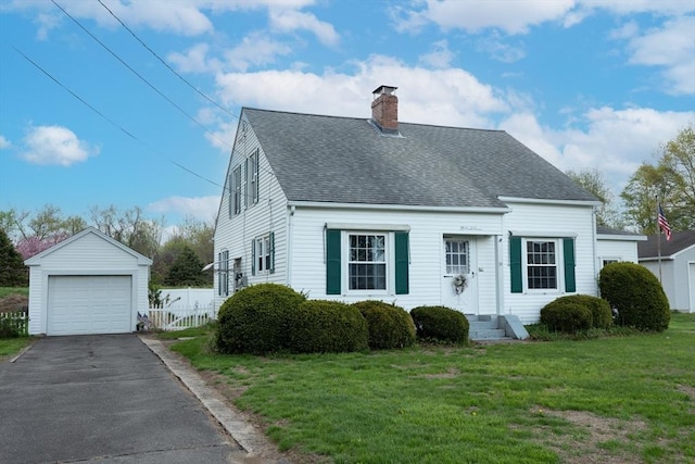 cape cod house with a chimney, a shingled roof, an outbuilding, a detached garage, and driveway