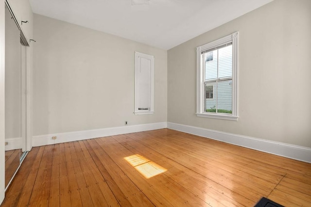 57 Rindge Ave, Cambridge, MA 02140 - spare room with baseboards and wood-type flooring