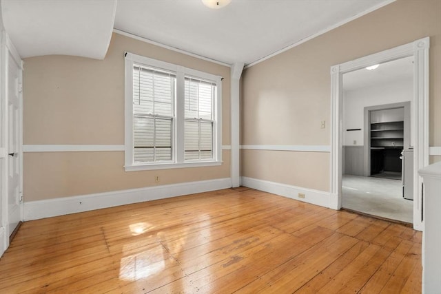 57 Rindge Ave, Cambridge, MA 02140 - spare room featuring light wood-style floors, crown molding, baseboards, and built in features