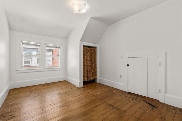 57 Rindge Ave, Cambridge, MA 02140 - additional living space featuring hardwood / wood-style floors, vaulted ceiling, and baseboards