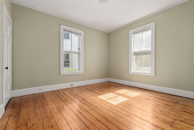 57 Rindge Ave, Cambridge, MA 02140 - empty room featuring crown molding, baseboards, and hardwood / wood-style floors