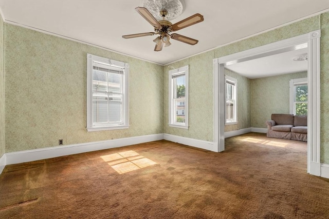 57 Rindge Ave, Cambridge, MA 02140 - carpeted empty room featuring a ceiling fan, crown molding, and baseboards