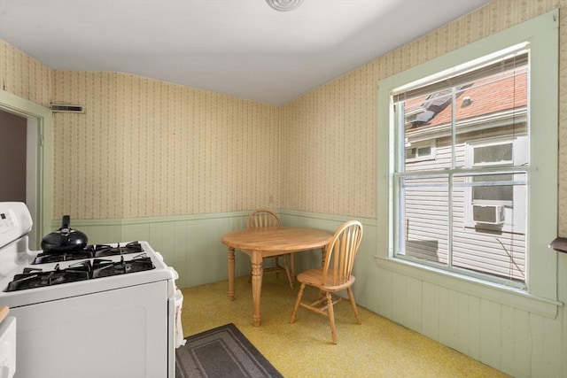 57 Rindge Ave, Cambridge, MA 02140 - dining area featuring a wainscoted wall