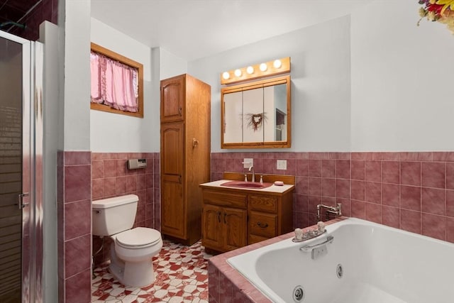 57 Rindge Ave, Cambridge, MA 02140 - bathroom with tile walls, a tub with jets, a shower stall, toilet, and vanity