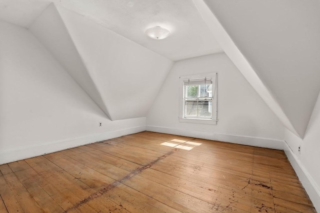57 Rindge Ave, Cambridge, MA 02140 - bonus room with hardwood / wood-style floors, vaulted ceiling, and baseboards