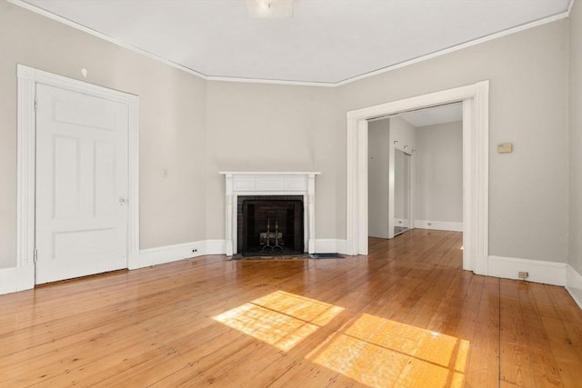 57 Rindge Ave, Cambridge, MA 02140 - unfurnished living room with ornamental molding, a fireplace with flush hearth, baseboards, and hardwood / wood-style floors