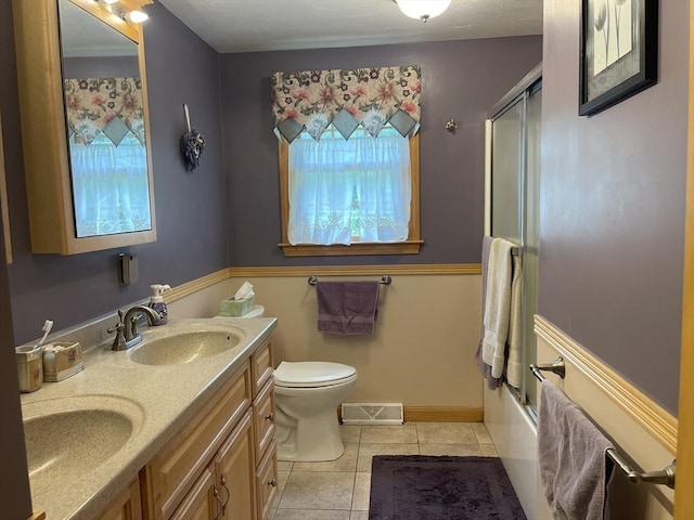 20 Colby Rd, Bridgewater, MA 02324 - full bathroom featuring plenty of natural light, double vanity, tile patterned floors, and enclosed tub / shower combo