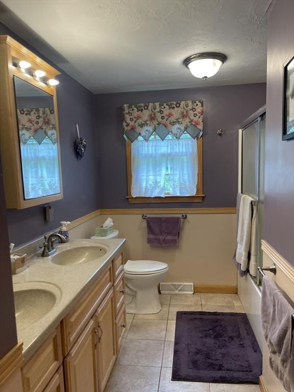 20 Colby Rd, Bridgewater, MA 02324 - full bathroom with tile patterned flooring, double vanity, combined bath / shower with glass door, and a textured ceiling