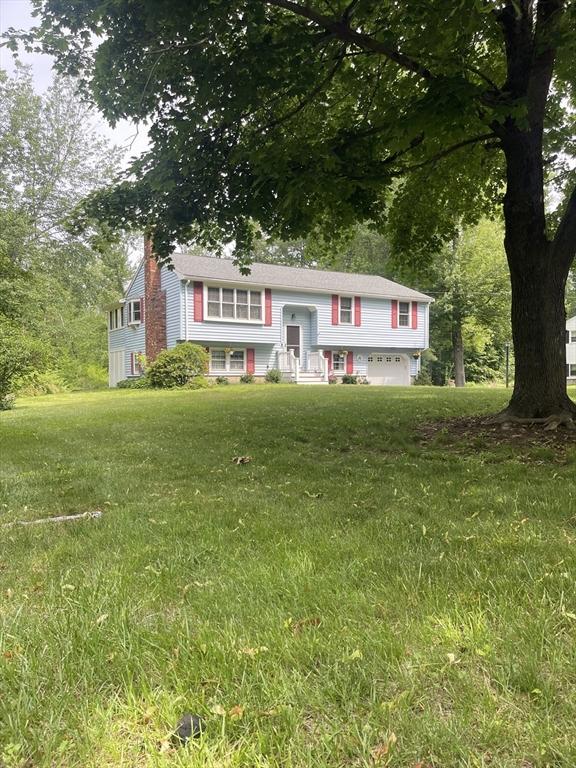 20 Colby Rd, Bridgewater, MA 02324 - raised ranch featuring a chimney, a garage, and a front lawn
