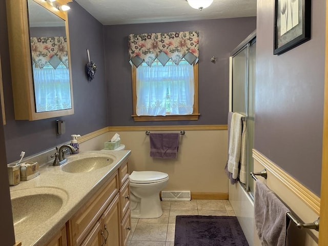 20 Colby Rd, Bridgewater, MA 02324 - bathroom with tile patterned flooring, double vanity, and shower / bath combination with glass door