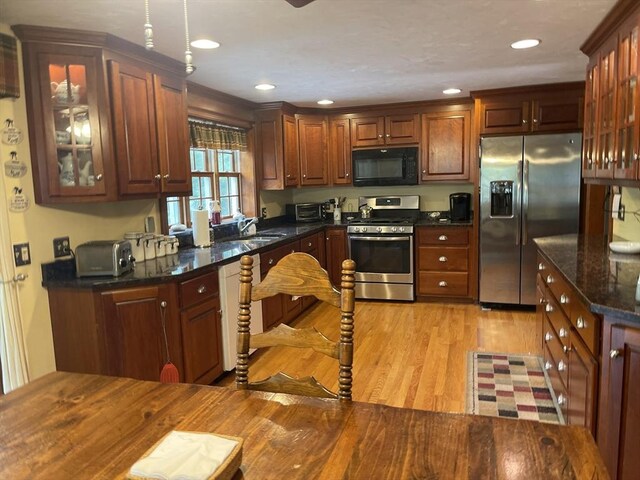 20 Colby Rd, Bridgewater, MA 02324 - kitchen featuring stainless steel appliances, light wood-type flooring, glass insert cabinets, recessed lighting, and dark stone countertops
