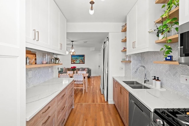 220-224 Washington St Unit 6, Brookline, MA 02445 - kitchen with a sink, light wood-style floors, open shelves, and stainless steel appliances