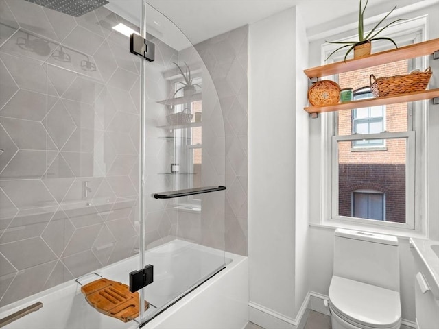 220-224 Washington St Unit 6, Brookline, MA 02445 - full bath with toilet, baseboards, and combined bath / shower with glass door