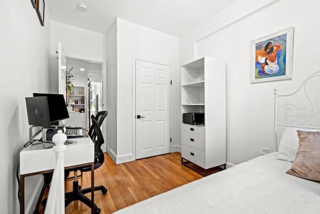 220-224 Washington St Unit 6, Brookline, MA 02445 - bedroom with baseboards and light wood-style floors
