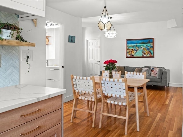 220-224 Washington St Unit 6, Brookline, MA 02445 - dining area featuring light wood-type flooring and baseboards