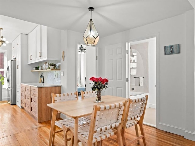 220-224 Washington St Unit 6, Brookline, MA 02445 - dining room featuring baseboards, a wealth of natural light, and light wood-style floors