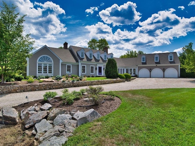 cape cod house featuring a front lawn