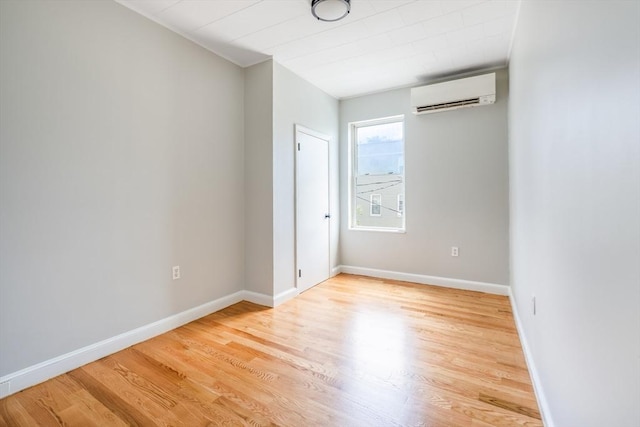 39 Mount Pleasant St, Somerville, MA 02145 - spare room featuring a wall mounted air conditioner and wood finished floors