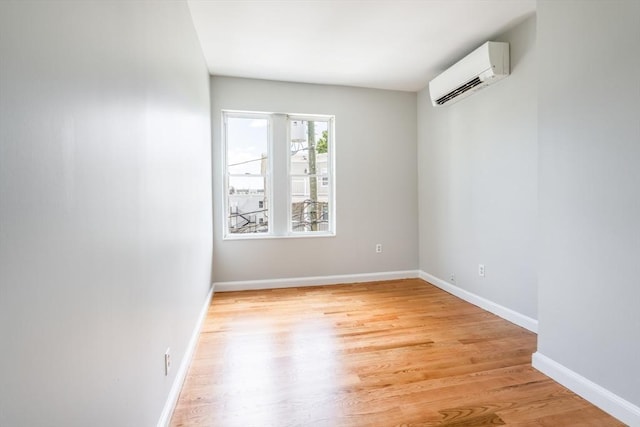39 Mount Pleasant St, Somerville, MA 02145 - empty room with a wall mounted AC and light wood finished floors