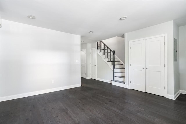 39 Mount Pleasant St, Somerville, MA 02145 - unfurnished living room with stairway, dark wood-style floors, recessed lighting, and electric panel