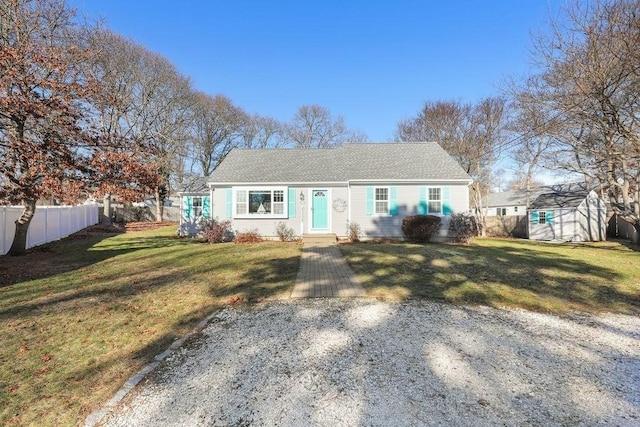 ranch-style home with a front lawn