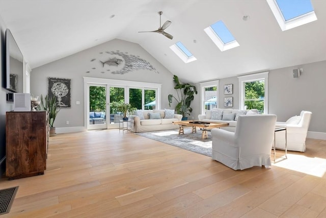 33 Pine Hill Rd, Newburyport, MA 01950 - living room featuring a skylight, high vaulted ceiling, light wood-style floors, and ceiling fan