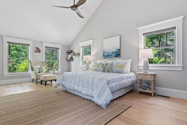 33 Pine Hill Rd, Newburyport, MA 01950 - bedroom with multiple windows, wood-type flooring, a high ceiling, and a ceiling fan