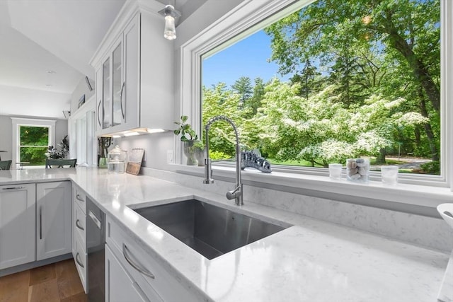 33 Pine Hill Rd, Newburyport, MA 01950 - kitchen with white cabinetry, light stone countertops, dark wood-style floors, stainless steel dishwasher, and lofted ceiling