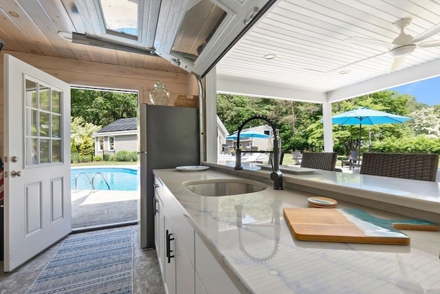 33 Pine Hill Rd, Newburyport, MA 01950 - view of patio / terrace featuring ceiling fan, exterior bar, and an outdoor pool